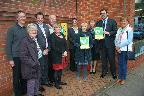 Eaton Councillor and representatives of EVRA and Waitrose mark the unveiling of the defibrillator.